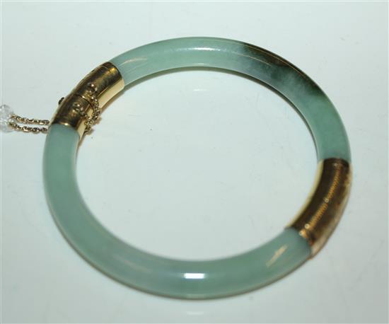 A 14ct gold mounted jadeite hinged bangle,